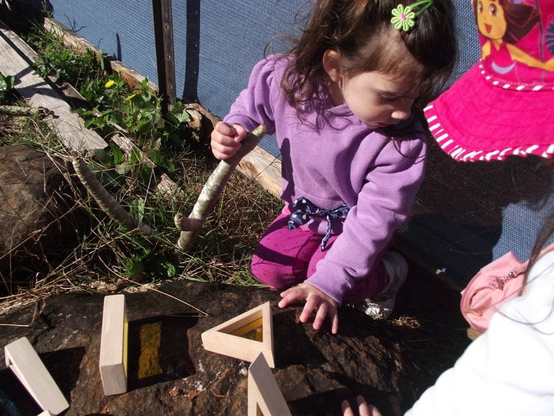 Simple toddler activity ideas to explore colour and texture through outdoor block play!