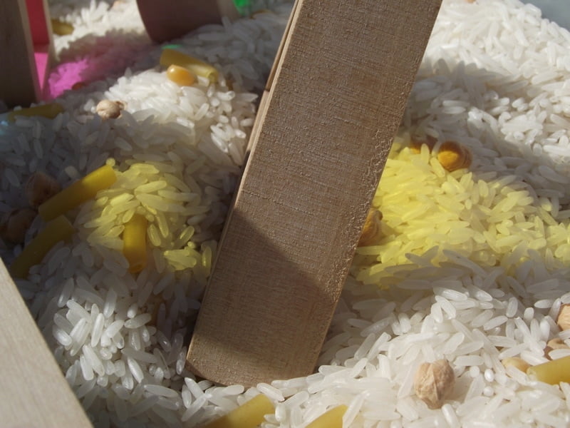 Simple toddler activity ideas to explore colour and texture through outdoor block play!