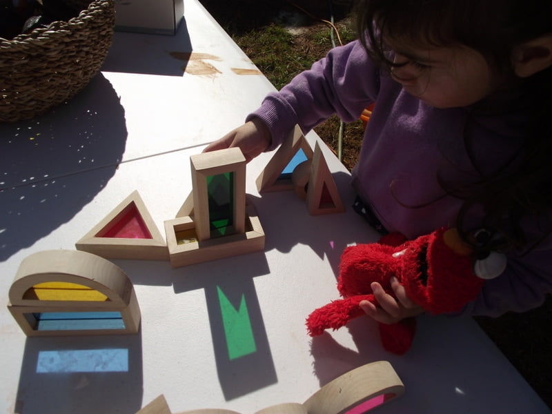 Simple toddler activity ideas to explore colour and texture through outdoor block play!