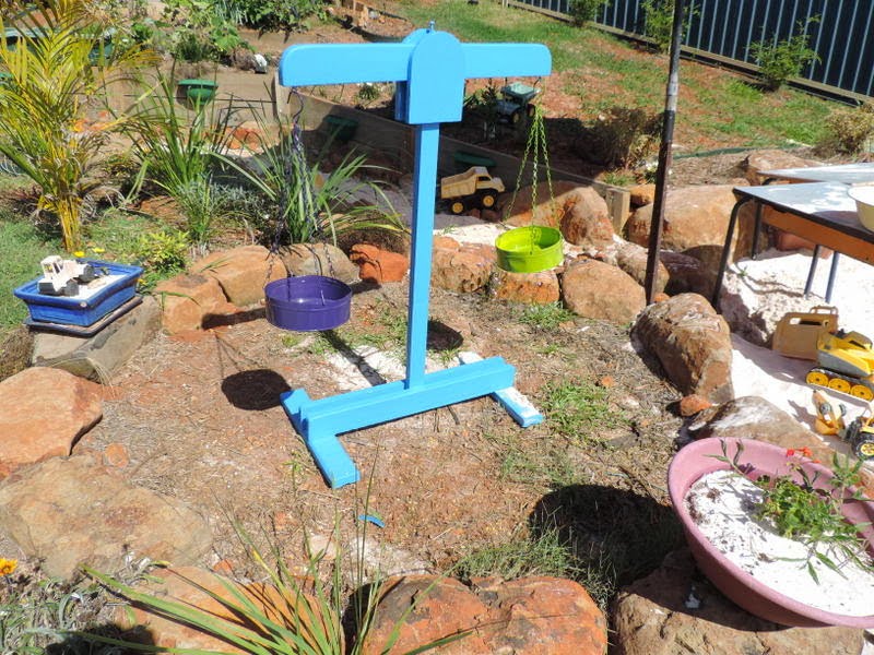 Building and using wooden scales in an outdoor playspace - Mummy Musings and Mayhem