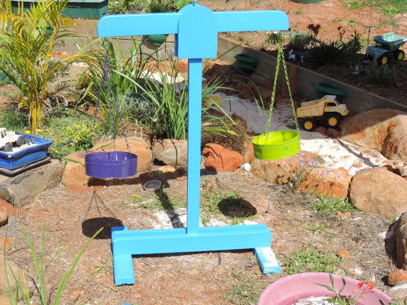 Building and using wooden scales in an outdoor playspace - Mummy Musings and Mayhem