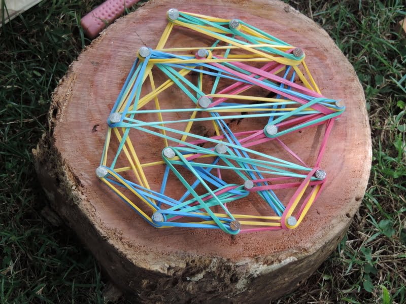 An easy DIY project to do with children - create wooden geoboards to explore patterns, shapes and colour while having fun with outdoor play! Great activity for home daycare and multiage groups!