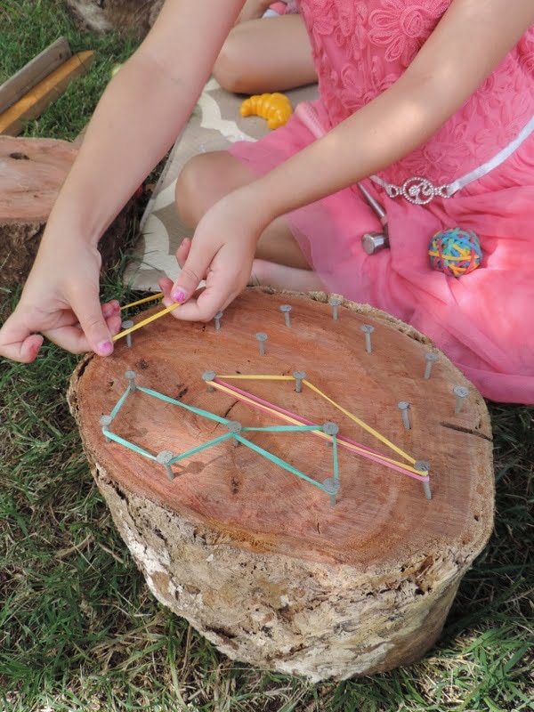 An easy DIY project to do with children - create wooden geoboards to explore patterns, shapes and colour while having fun with outdoor play! Great activity for home daycare and multiage groups!