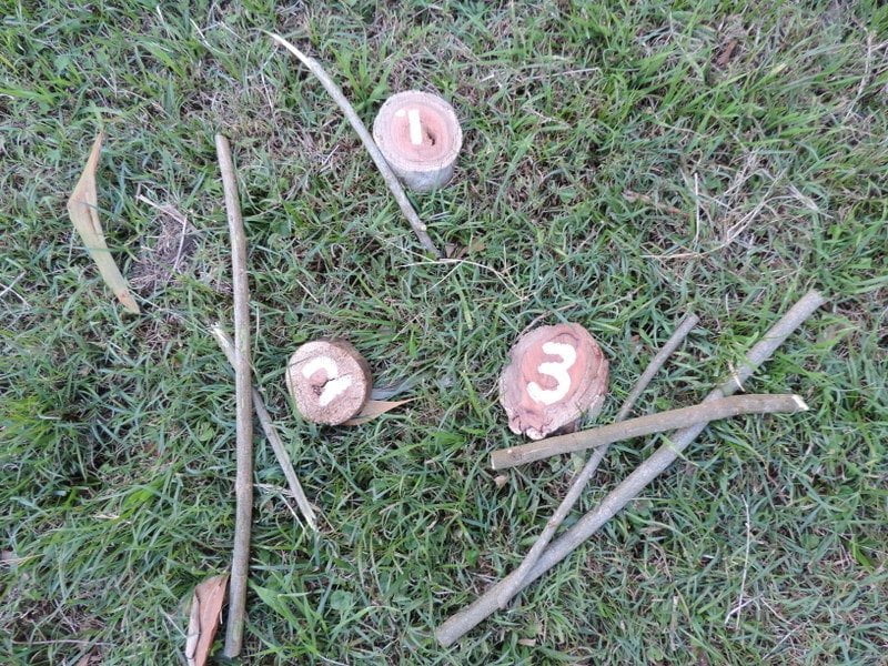 8 easy ideas to introduce play based learning activities into children's outdoor play using wooden cookies, nature and simple DIY resources. Fantastic ideas here for early childhood teachers, educators and homeschool!