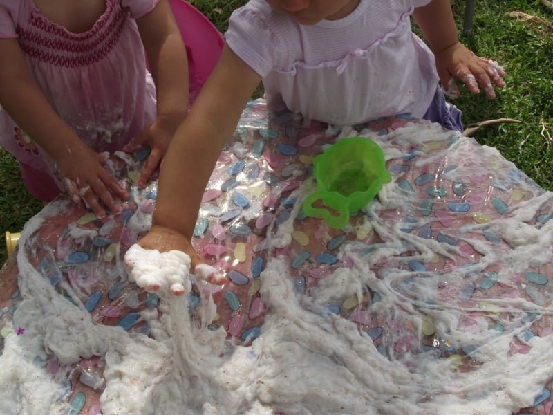 Follow this easy budget friendly recipe to make your own batch of soapy slime for sensory play. Safe for baby & toddler and a whole lot of messy fun!