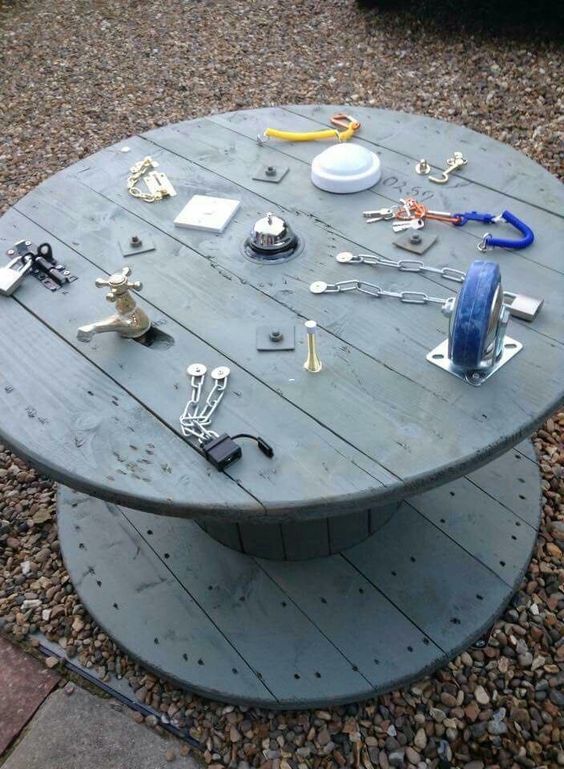 Repurpose wooden spools and cable reels for play