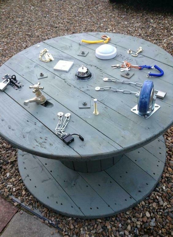 Cable spool repurposed as tables and chairs, house and garden furniture.