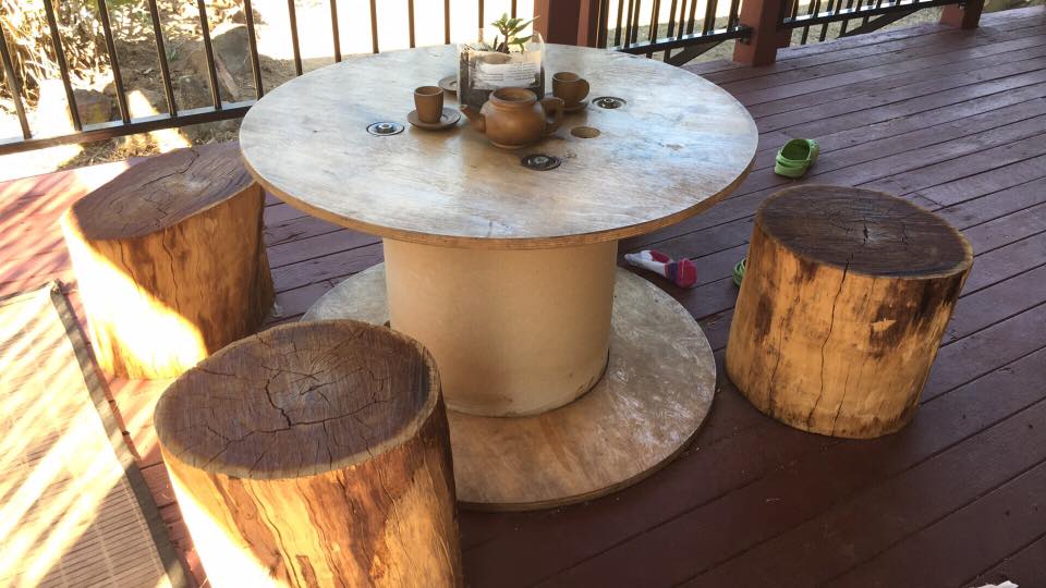 Repurpose wooden spools and cable reels for play