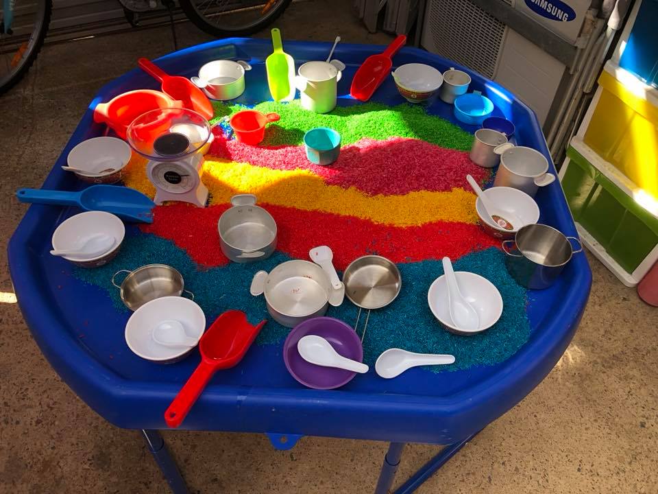 rainbow rice and pots and pans Setup up these simple activity ideas for toddlers and help them learn through play - no hours of prep or expensive materials required! Ideas for early childhood educators, teachers, nursery and homeschool families!