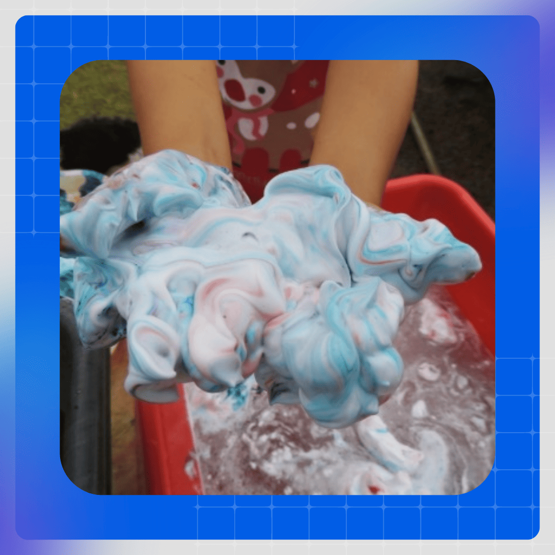 Hands covered in colourful shaving foam