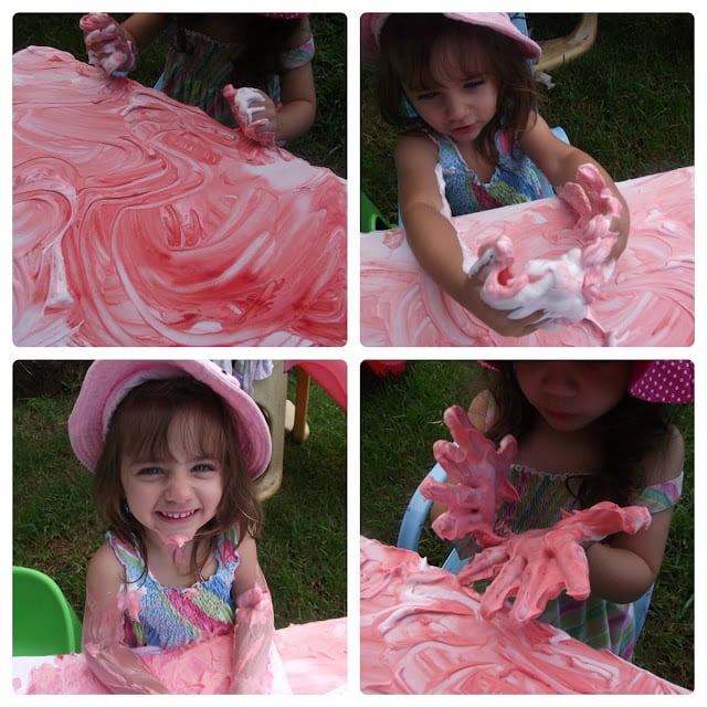 toddler girl playing with foam and paint sensory fun