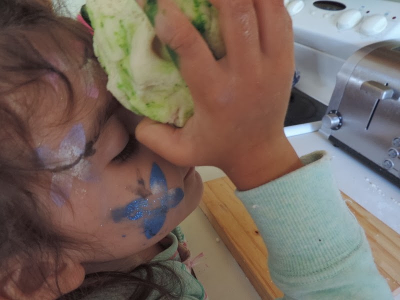 child with sensory processing challenges smelling playdough with lavender oil