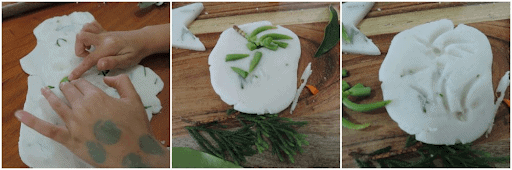 homemade sensory white clay with green leaves and other natural materials