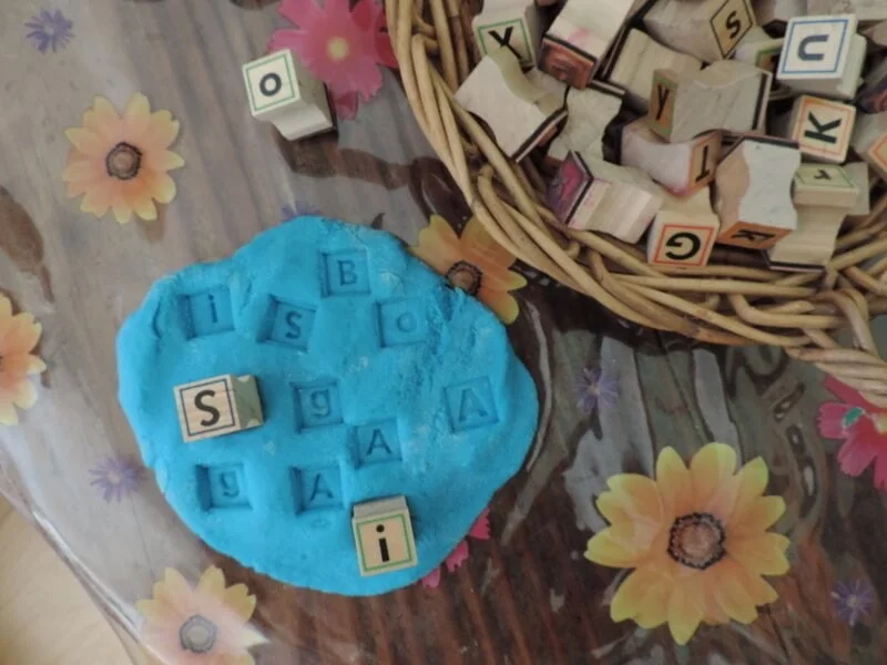 playdough literacy letter stamping activity