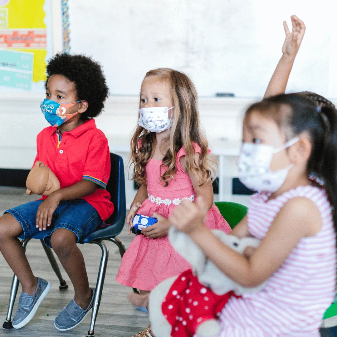 children wearing masks in preschool centre