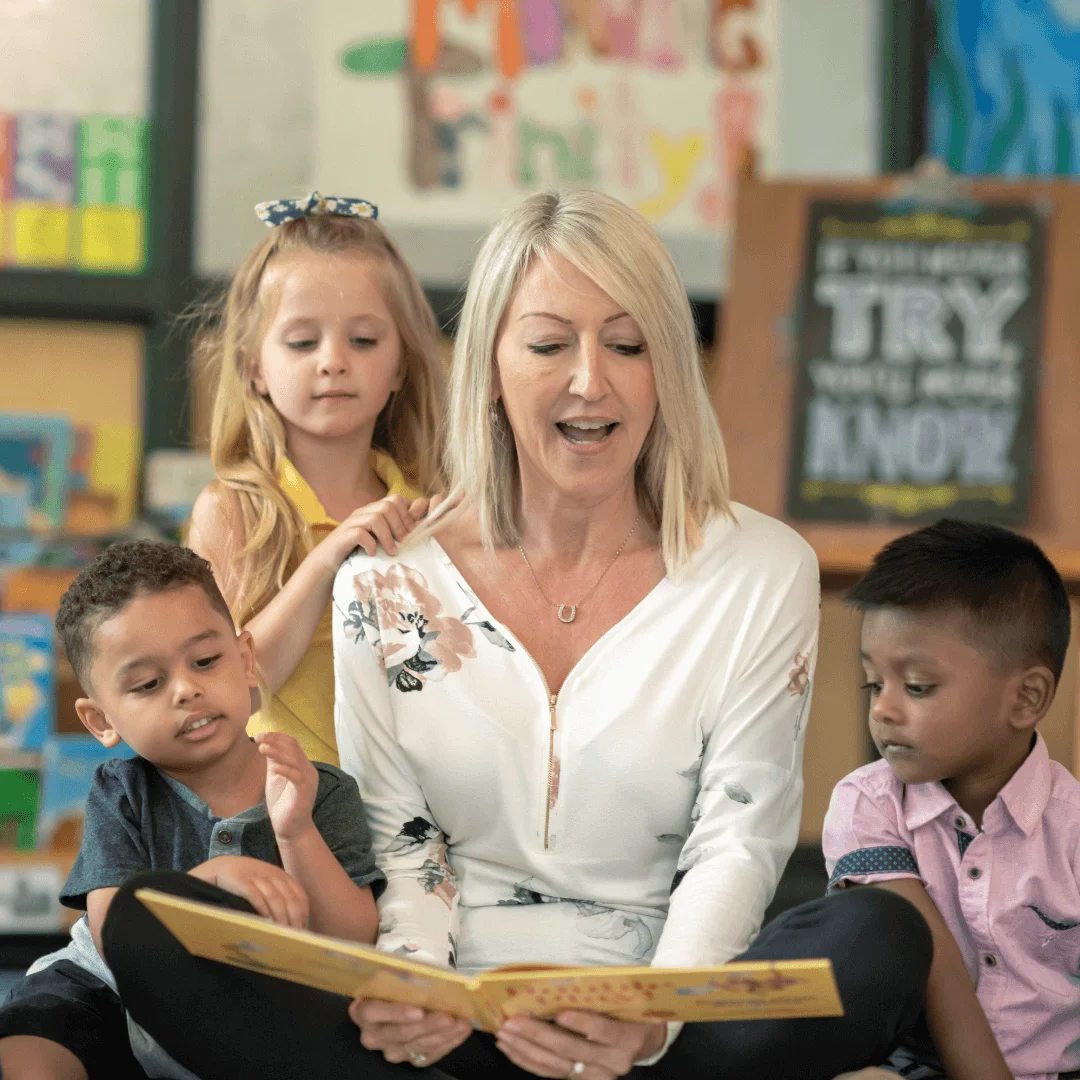 educator reading to children in preschool