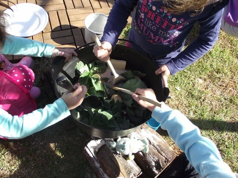 stone soup dramatic play outdoors 