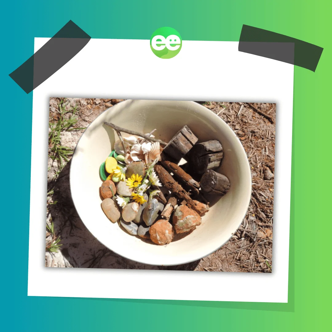 loose parts play materials in a bowl for outdoor children's play