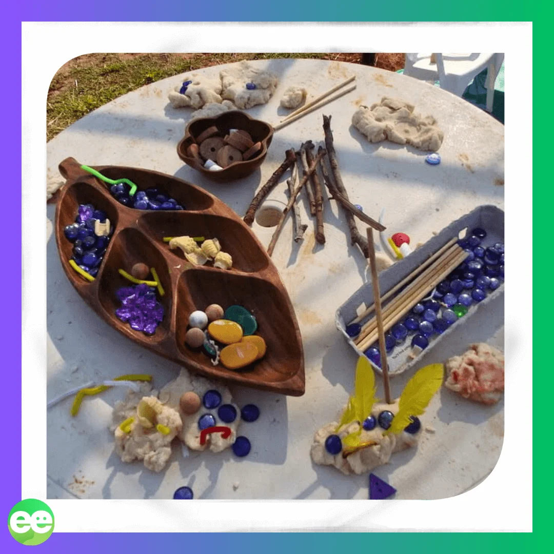 loose parts and playdough activity setup on table for children